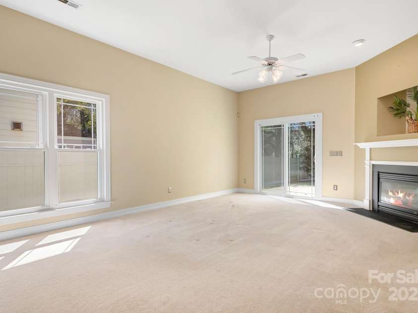 19221 Coachmans Trace, Cornelius, NC 28031.  MLS# CAR4241031, YatesRealty ID 10121. Another view off the spacious great room showing the natural light this room has from the windows and sliders.