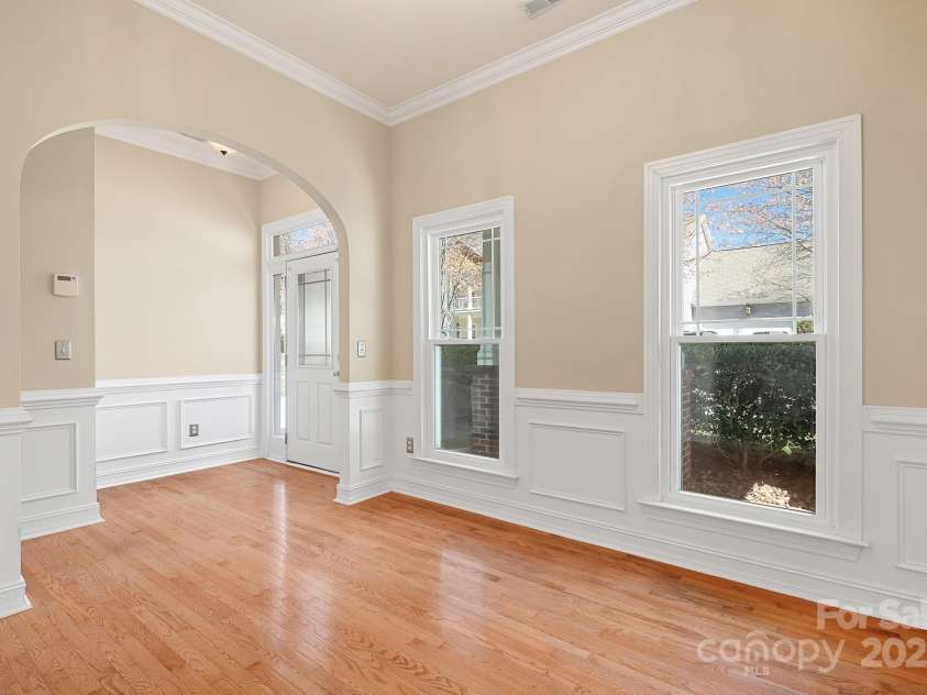 19221 Coachmans Trace, Cornelius, NC 28031.  MLS# CAR4241031, YatesRealty ID 10121. Enter this home through the entry hall with wood floors that meanders not the dining room.  This room also works well as an office space or small den.