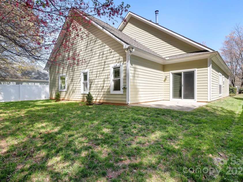 19221 Coachmans Trace, Cornelius, NC 28031.  MLS# CAR4241031, YatesRealty ID 10121. Rear view of home
