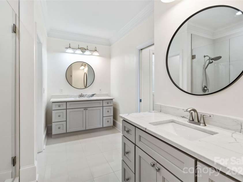 5916 Bridger Court, Charlotte, NC 28211.  MLS# CAR4184678, YatesRealty ID 10123. Separated gorgeous vanities in Primary bathroom