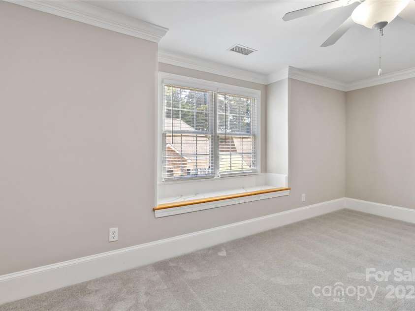 5916 Bridger Court, Charlotte, NC 28211.  MLS# CAR4184678, YatesRealty ID 10123. Upstairs bedroom with a window seat.