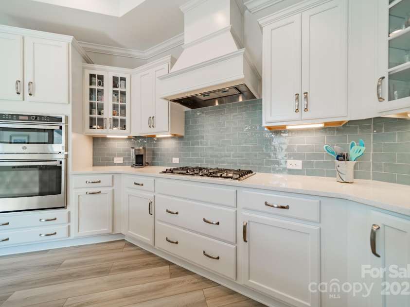 2014 Newstyle Way, Tega Cay, SC 29708.  MLS# CAR4190595, YatesRealty ID 10124. Kitchen with Wall Oven and Microwave and 5-Burner Gas Cooktop and Vented Exhaust Hood