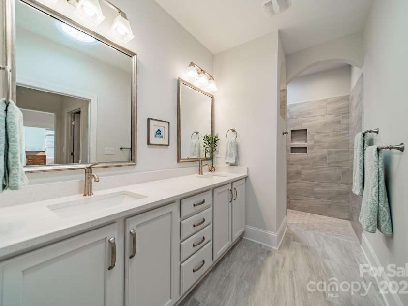 2014 Newstyle Way, Tega Cay, SC 29708.  MLS# CAR4190595, YatesRealty ID 10124. Primary Bathroom with Double Vanities and a Zero Threshold Shower