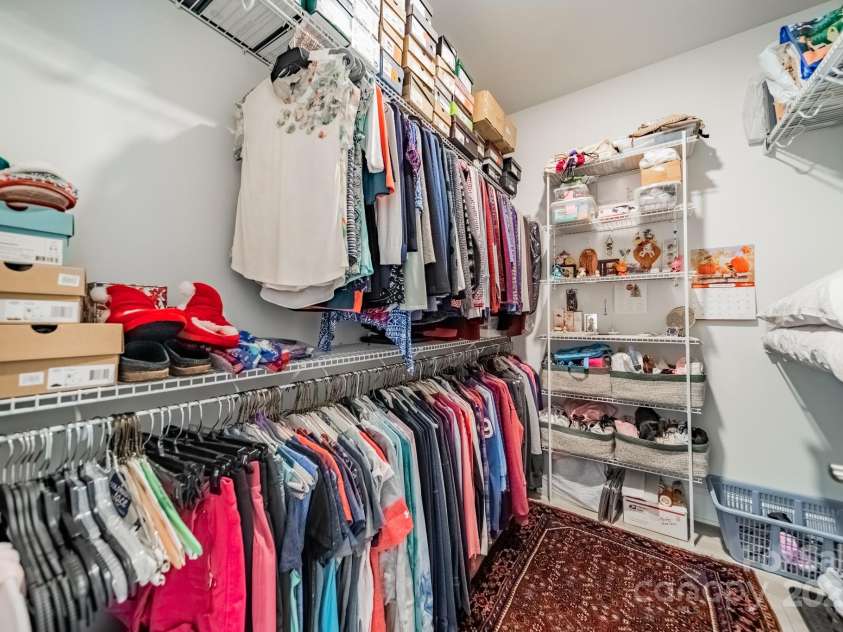 2014 Newstyle Way, Tega Cay, SC 29708.  MLS# CAR4190595, YatesRealty ID 10124. Primary Closet with reinforced wire shelving