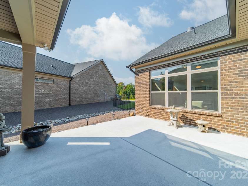 2014 Newstyle Way, Tega Cay, SC 29708.  MLS# CAR4190595, YatesRealty ID 10124. Side Patio