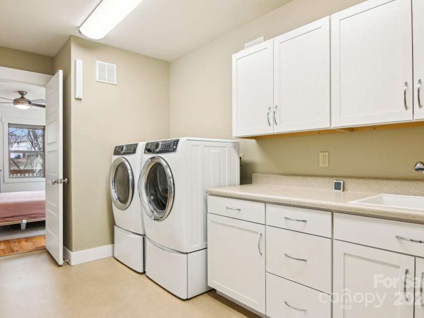 12 Mayfield Road, Asheville, NC 28804.  MLS# CAR4312974, YatesRealty ID 10128. Huge laundry room & storage downstairs. 