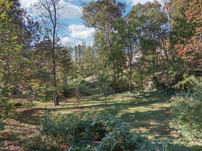 12 Mayfield Road, Asheville, NC 28804.  MLS# CAR4312974, YatesRealty ID 10128. Parklike setting backyard! 