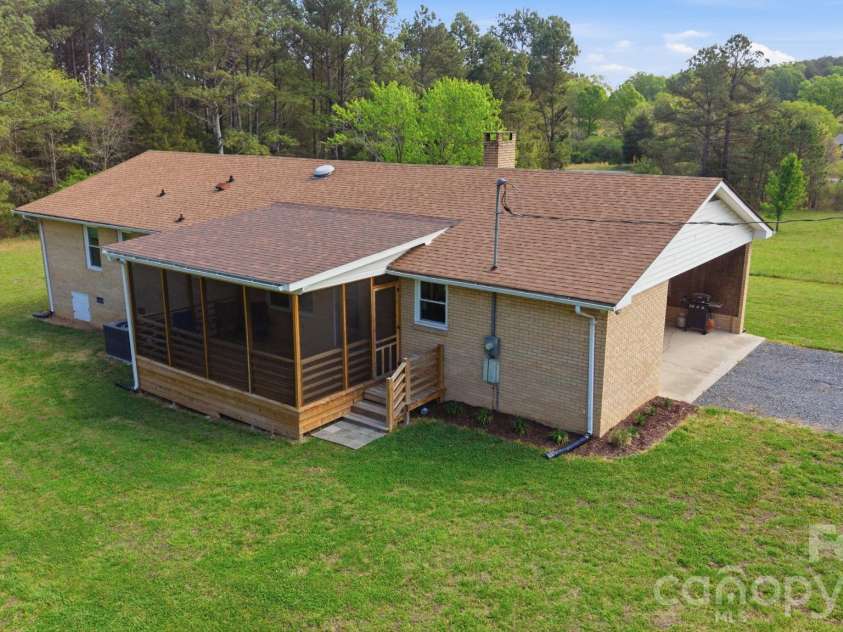 12227 NC 138 Highway, Norwood, NC 28128.  MLS# CAR4366080, YatesRealty ID 10130. Rear and Left Side View