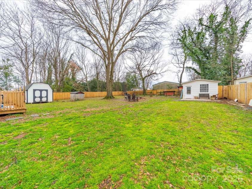 404 Plaza Drive, Harrisburg, NC 28075.  MLS# CAR4232649, YatesRealty ID 10142. Huge backyard!