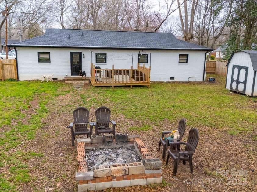 404 Plaza Drive, Harrisburg, NC 28075.  MLS# CAR4232649, YatesRealty ID 10142. Huge backyard!