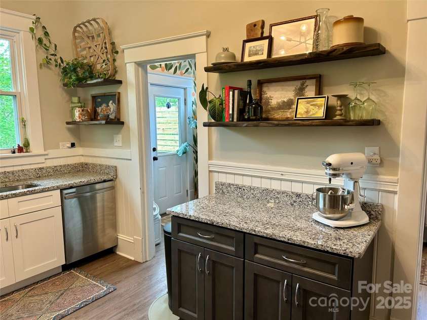 705 Fulton Street, Salisbury, NC 28144.  MLS# CAR4248091, YatesRealty ID 10143. Kitchen with view of rear door to deck
