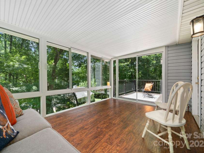 701 Salisbury Road, Hendersonville, NC 28792.  MLS# CAR4279569, YatesRealty ID 10145. Screened in Porch