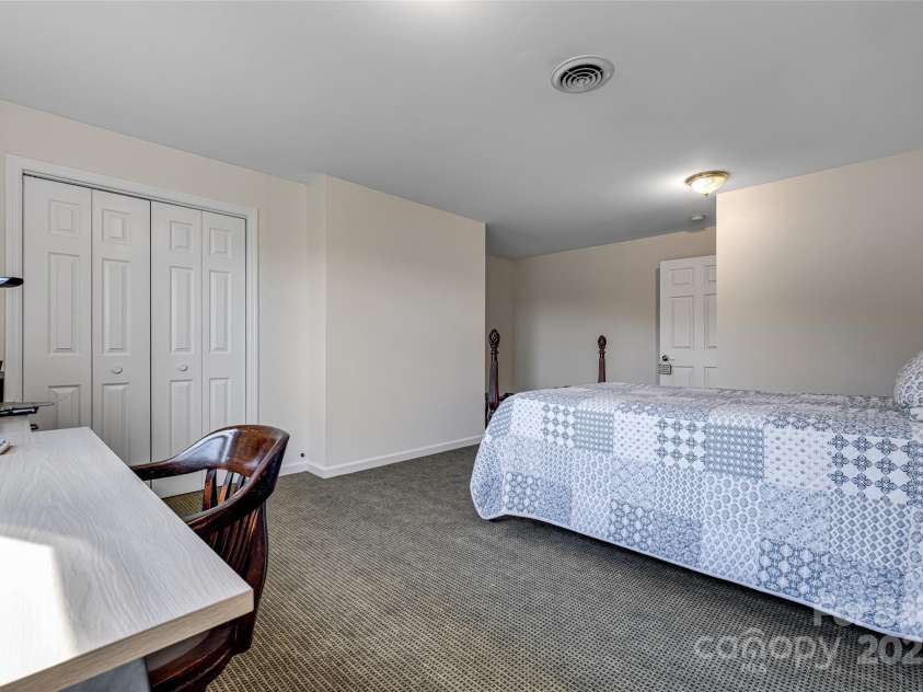77 Chestnut Street, Tryon, NC 28782.  MLS# CAR4307733, YatesRealty ID 1015. Downstairs bedroom. 