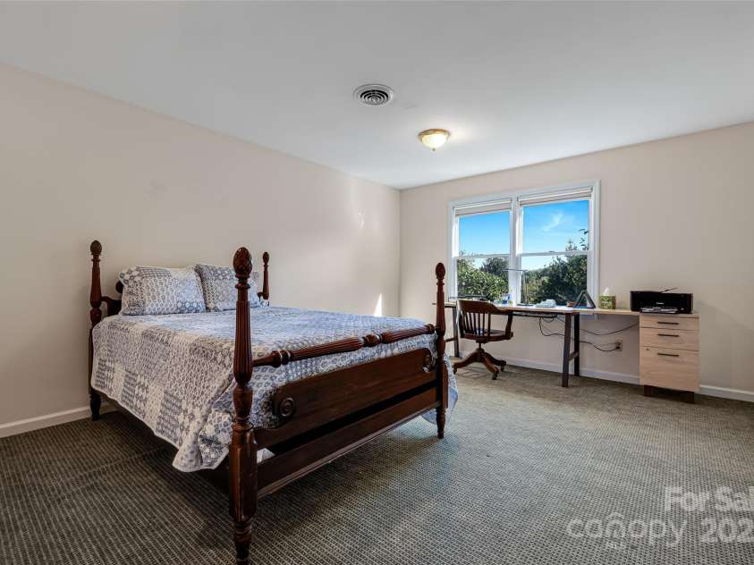 77 Chestnut Street, Tryon, NC 28782.  MLS# CAR4307733, YatesRealty ID 1015. The downstairs bedroom is private for guests or caregivers. 