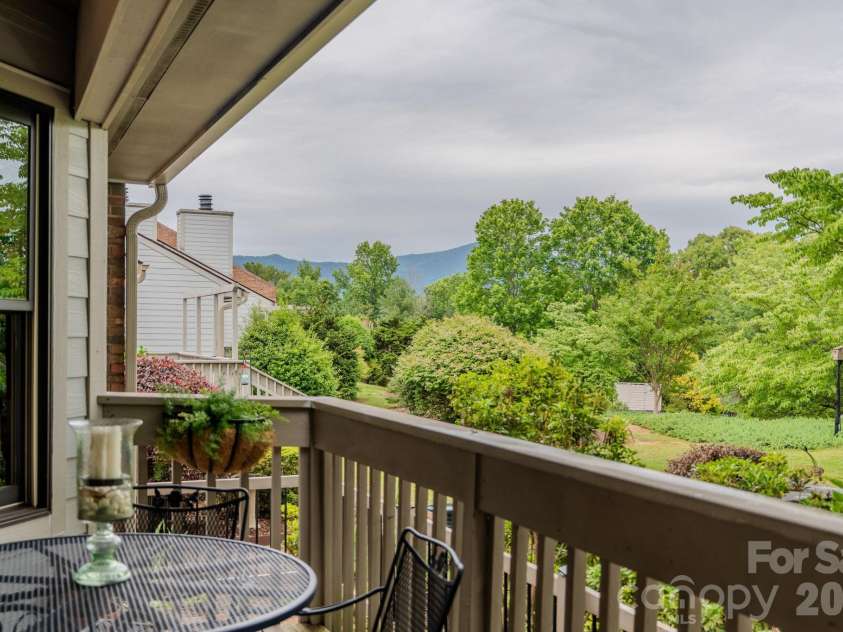 77 Chestnut Street, Tryon, NC 28782.  MLS# CAR4389953, YatesRealty ID 1015. Distant mountain views from deck