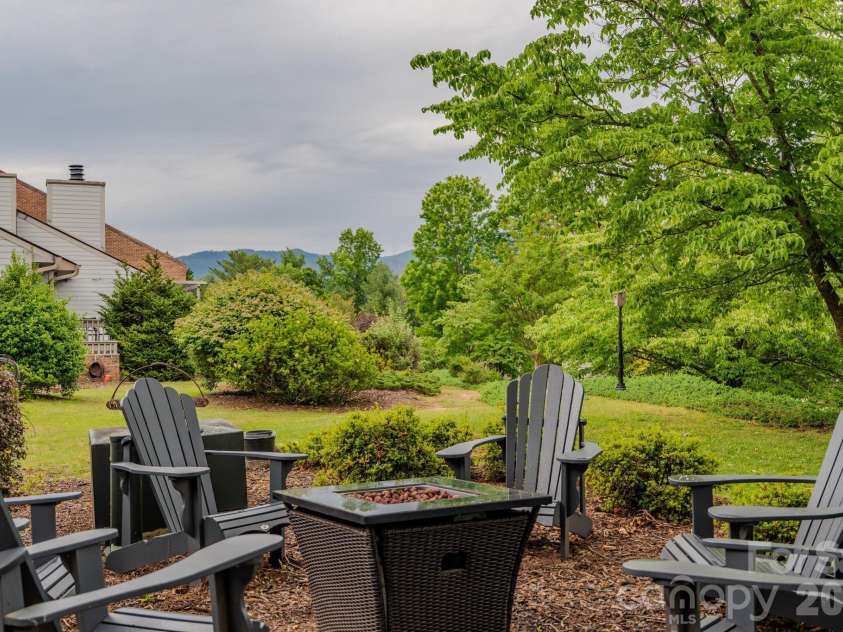 77 Chestnut Street, Tryon, NC 28782.  MLS# CAR4389953, YatesRealty ID 1015. Firepit with distant Mountain views