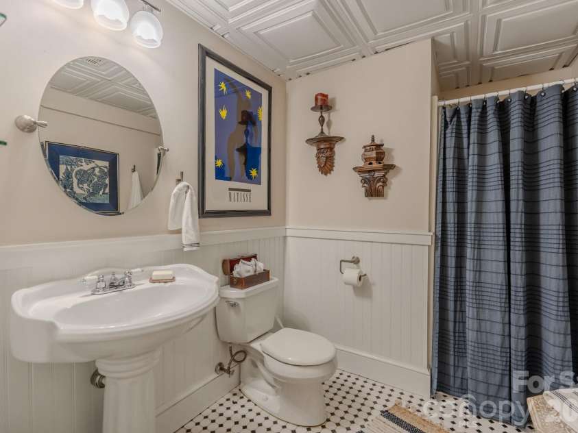 77 Chestnut Street, Tryon, NC 28782.  MLS# CAR4389953, YatesRealty ID 1015. Guest Bath on Main Level