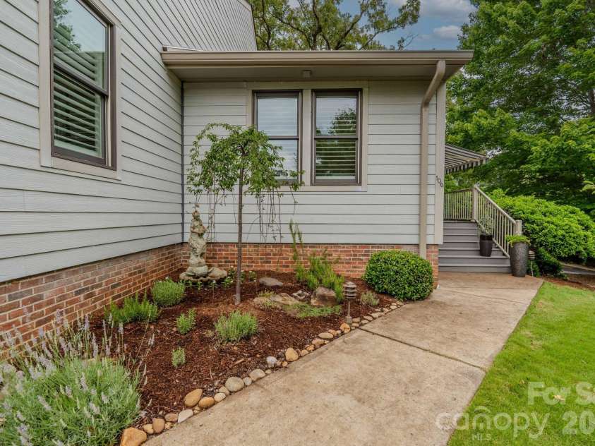 77 Chestnut Street, Tryon, NC 28782.  MLS# CAR4389953, YatesRealty ID 1015. Walkway to front door