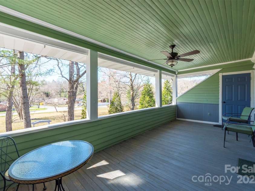 1740 Haywood Road, Hendersonville, NC 28791.  MLS# CAR4226897, YatesRealty ID 10150. Upstairs covered front porch accessible from two ensuite bedrooms.