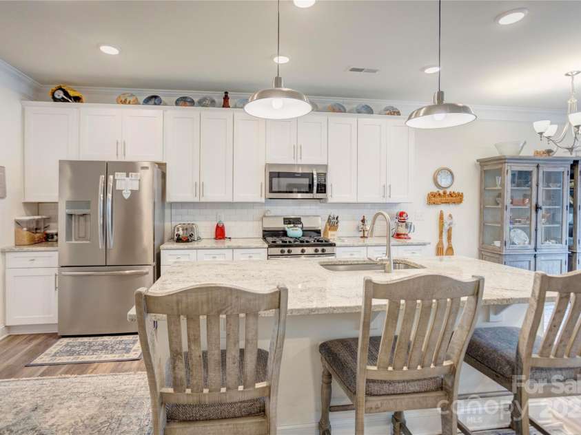 3941 Rothwood Lane, Harrisburg, NC 28075.  MLS# CAR4231989, YatesRealty ID 10152. Large island with seating