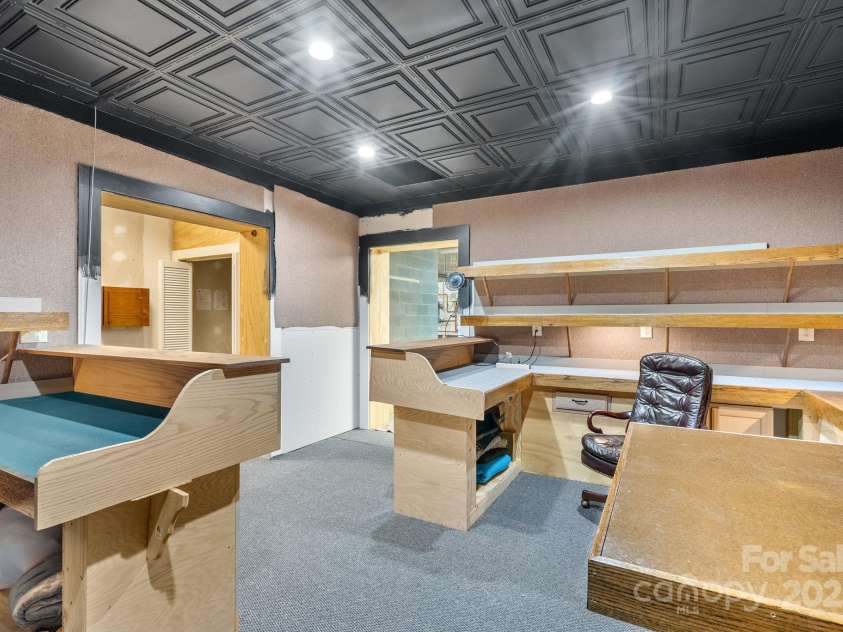 111 Flora Rose Trail, Asheville, NC 28803.  MLS# CAR4239614, YatesRealty ID 10160. Lower level hobby room