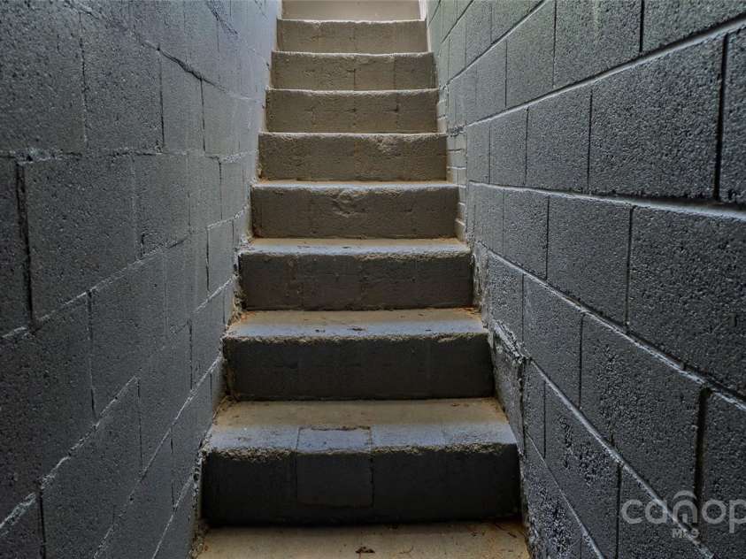 403 3rd Street, Conover, NC 28613.  MLS# CAR4251166, YatesRealty ID 10164. Outside Stairs to Basement