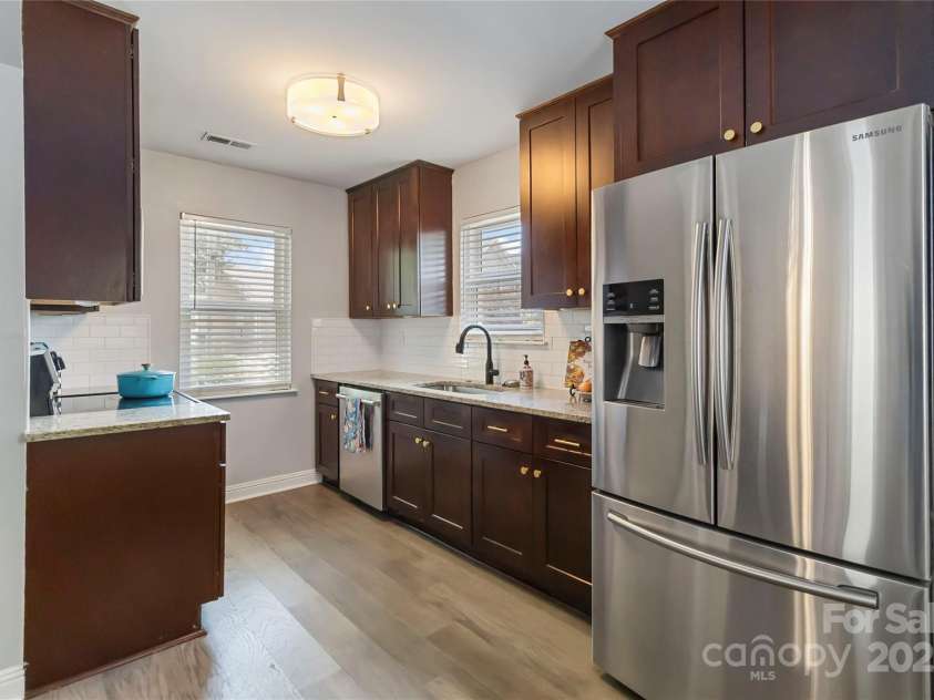 1509 Harrill Street, Charlotte, NC 28205.  MLS# CAR4280930, YatesRealty ID 10170. Kitchen boasts stainless steel appliances & soft-close cabinets & drawers