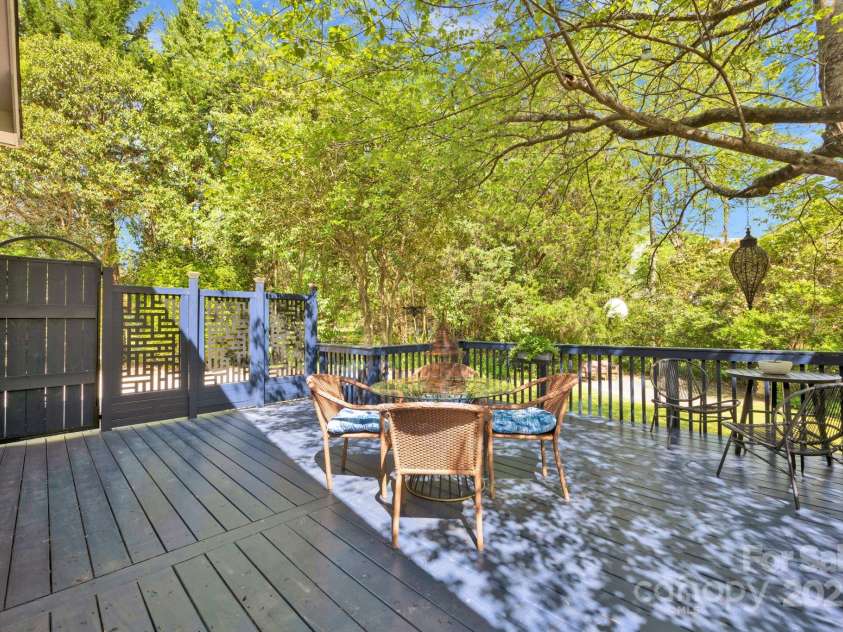 4937 Broken Saddle Lane, Charlotte, NC 28226.  MLS# CAR4244000, YatesRealty ID 10175. Awesome 396 SF deck with access to driveway and backyard. Perfectly perched under a gorgeous maple tree.