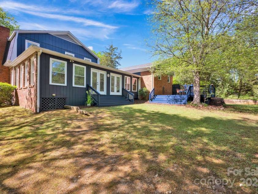 4937 Broken Saddle Lane, Charlotte, NC 28226.  MLS# CAR4244000, YatesRealty ID 10175. Double doors to the sunroom. Perfect place for a patio, pool and outdoor fireplace.