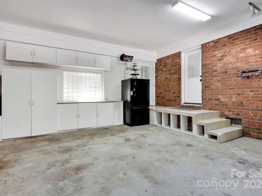 4937 Broken Saddle Lane, Charlotte, NC 28226.  MLS# CAR4244000, YatesRealty ID 10175. Garage with storage and comes with the refrigerator!