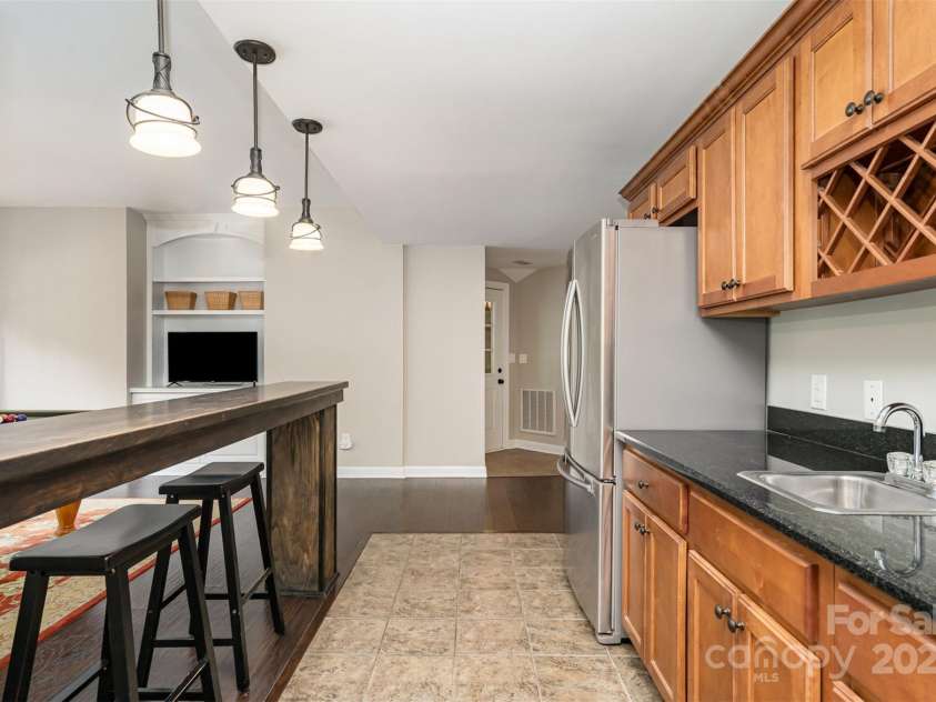 3306 Delamere Drive, Matthews, NC 28104.  MLS# CAR4247095, YatesRealty ID 10176. Basement kitchen/wetbar