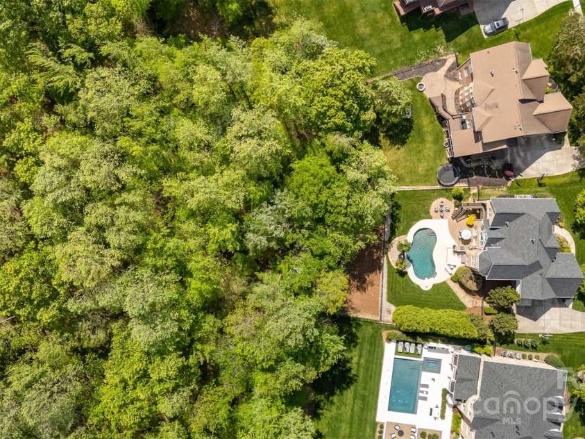 3306 Delamere Drive, Matthews, NC 28104.  MLS# CAR4247095, YatesRealty ID 10176. Huge wooded lot!