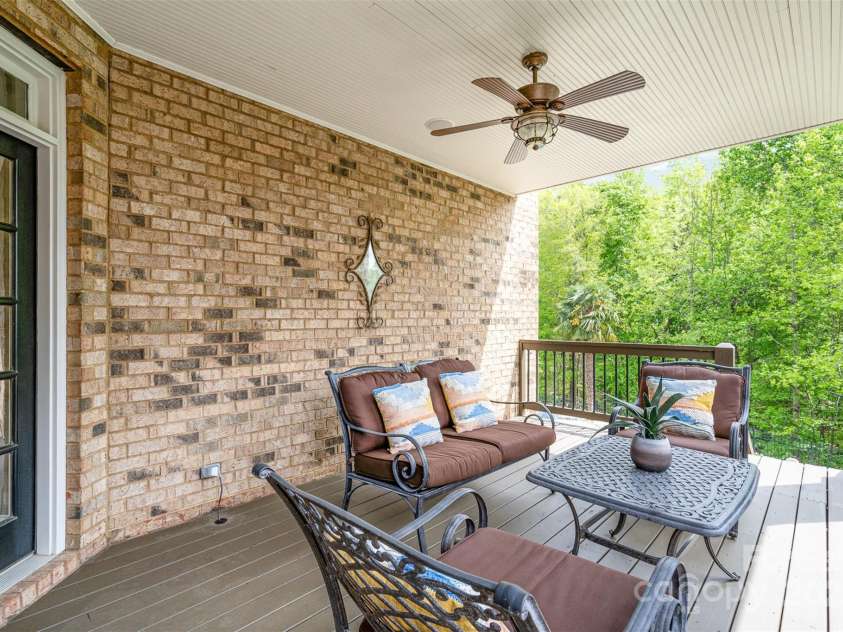 3306 Delamere Drive, Matthews, NC 28104.  MLS# CAR4247095, YatesRealty ID 10176. Main level covered patio with stairs to pool deck