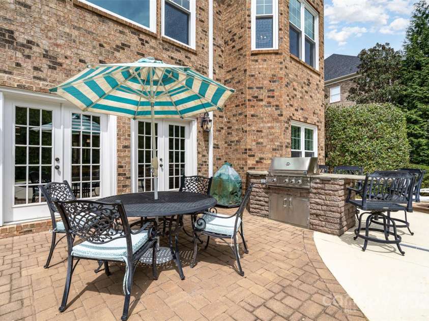 3306 Delamere Drive, Matthews, NC 28104.  MLS# CAR4247095, YatesRealty ID 10176. Sun-filled back patio and outdoor grill!