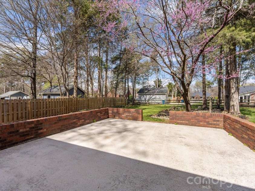8380 Rocky River Road, Harrisburg, NC 28075.  MLS# CAR4359781, YatesRealty ID 10177. Backyard