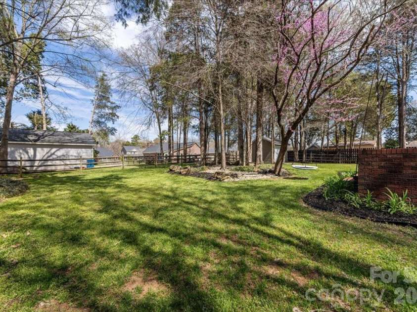 8380 Rocky River Road, Harrisburg, NC 28075.  MLS# CAR4359781, YatesRealty ID 10177. Backyard
