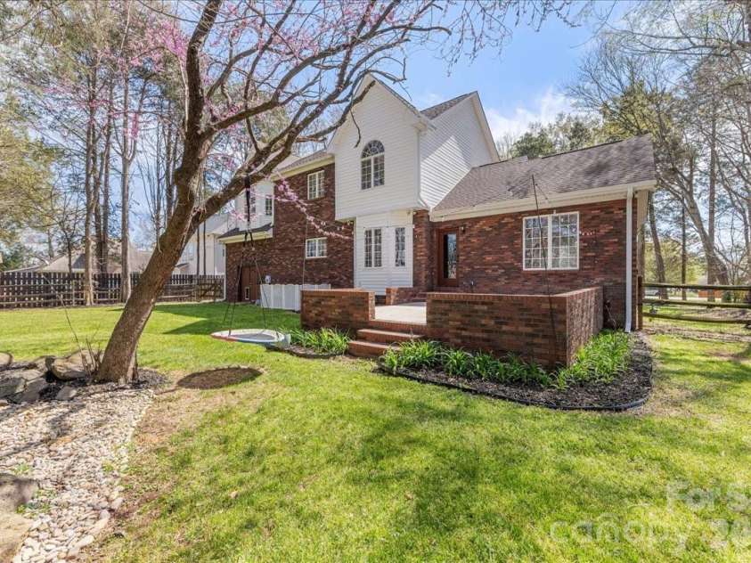 8380 Rocky River Road, Harrisburg, NC 28075.  MLS# CAR4359781, YatesRealty ID 10177. Backyard