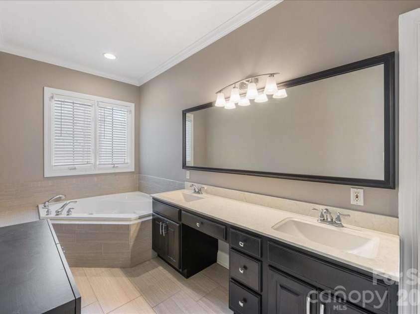 8380 Rocky River Road, Harrisburg, NC 28075.  MLS# CAR4359781, YatesRealty ID 10177. Primary bath