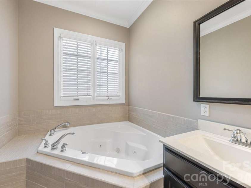 8380 Rocky River Road, Harrisburg, NC 28075.  MLS# CAR4359781, YatesRealty ID 10177. Primary bath