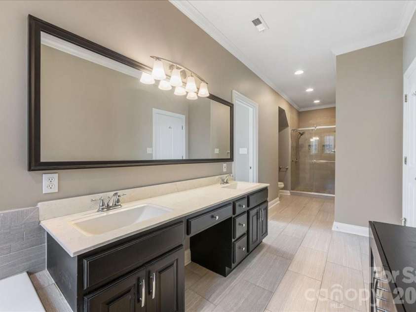 8380 Rocky River Road, Harrisburg, NC 28075.  MLS# CAR4359781, YatesRealty ID 10177. Primary bath