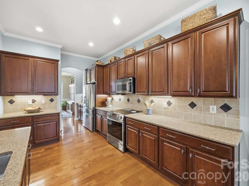 1132 Aringill Lane, Matthews, NC 28104.  MLS# CAR4361071, YatesRealty ID 10178. Ample counter space and cabinetry.
