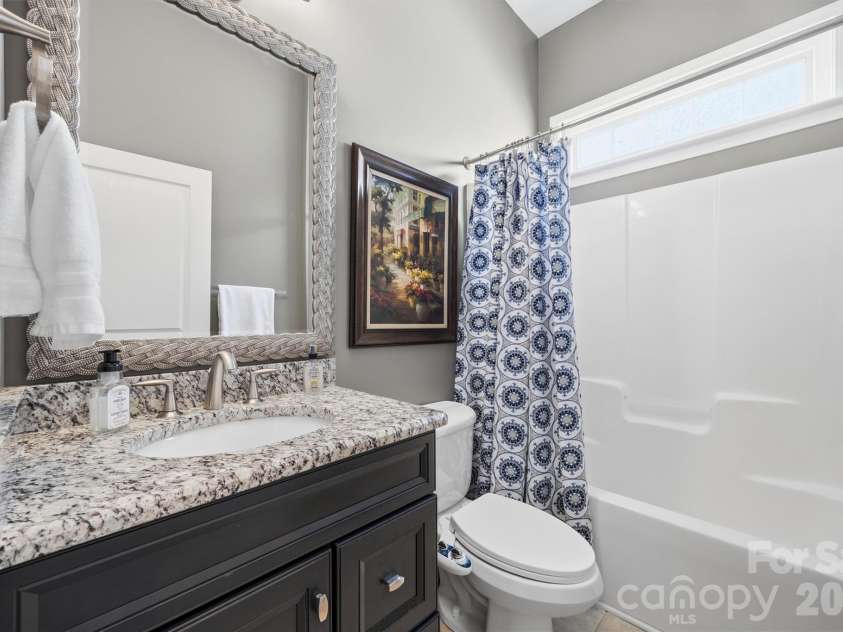 1132 Aringill Lane, Matthews, NC 28104.  MLS# CAR4361071, YatesRealty ID 10178. Bathroom 2 has a new vanity.