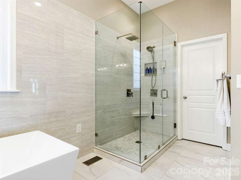 1132 Aringill Lane, Matthews, NC 28104.  MLS# CAR4361071, YatesRealty ID 10178. Large shower features both a rainfall showerhead and a handheld.