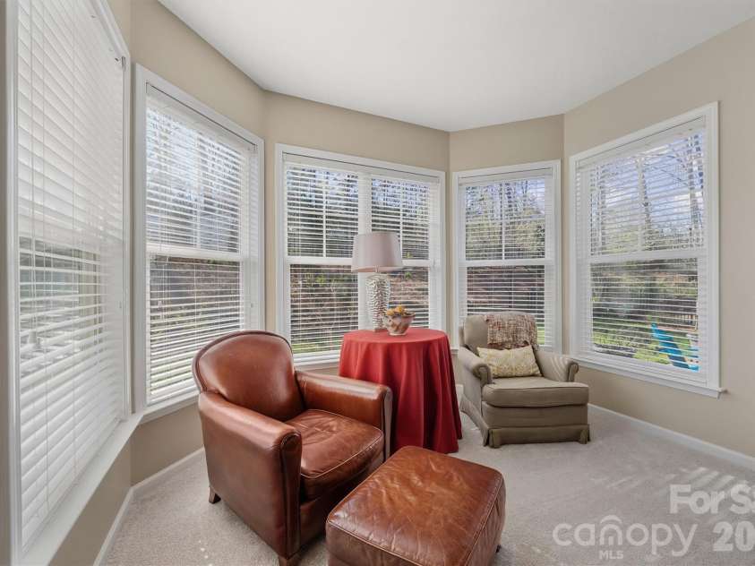 1132 Aringill Lane, Matthews, NC 28104.  MLS# CAR4361071, YatesRealty ID 10178. Sitting area surrounded by windows.