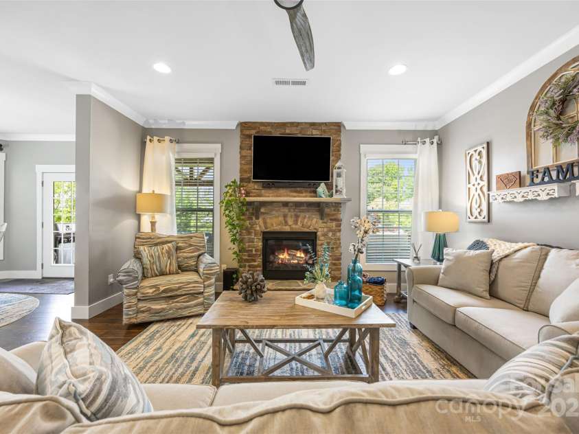 487 Hawks Creek Parkway, Fort Mill, SC 29708.  MLS# CAR4246089, YatesRealty ID 10180. Living room w/ gas fireplace