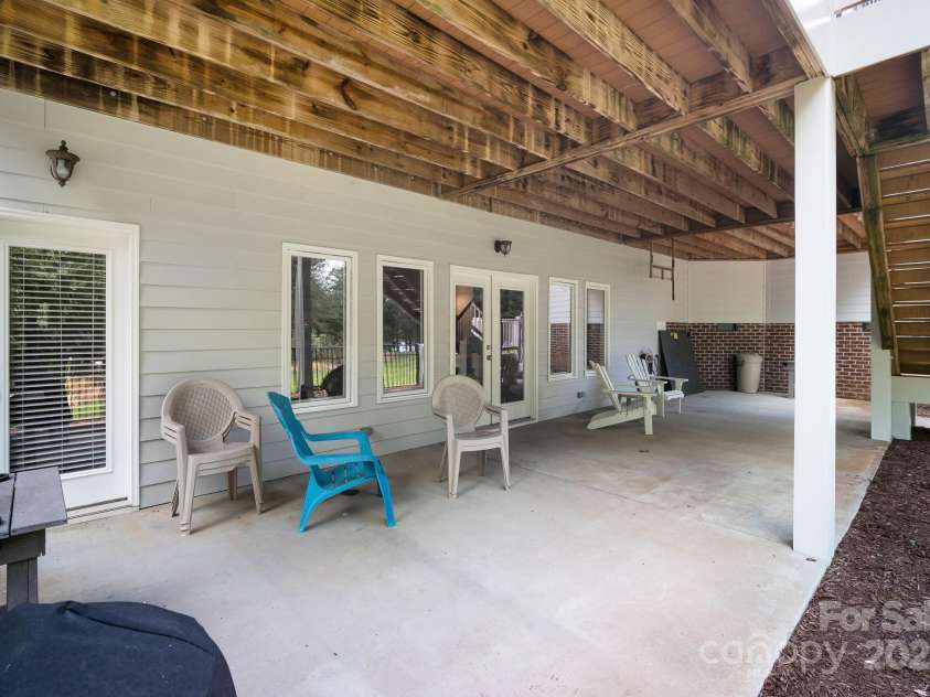 591 Emerald Isle Court, Lexington, NC 27292.  MLS# CAR4245365, YatesRealty ID 10185. Porch facing the lake (basement level)