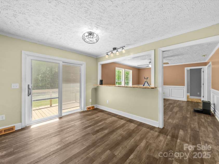 3546 Mount Pleasant Road, Concord, NC 28025.  MLS# CAR4247028, YatesRealty ID 10192. Dining area with slider to back deck