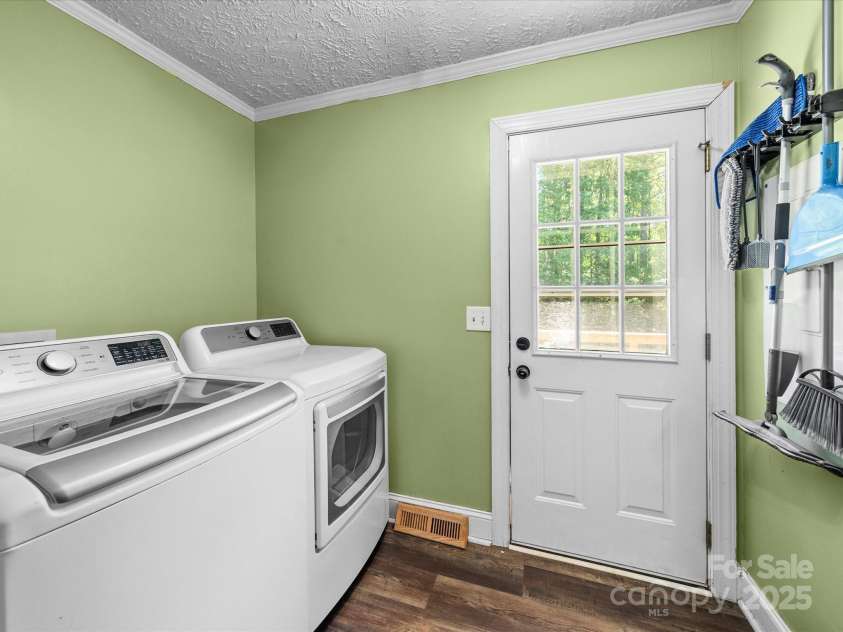 3546 Mount Pleasant Road, Concord, NC 28025.  MLS# CAR4247028, YatesRealty ID 10192. Laundry room off of kitchen with door to back deck