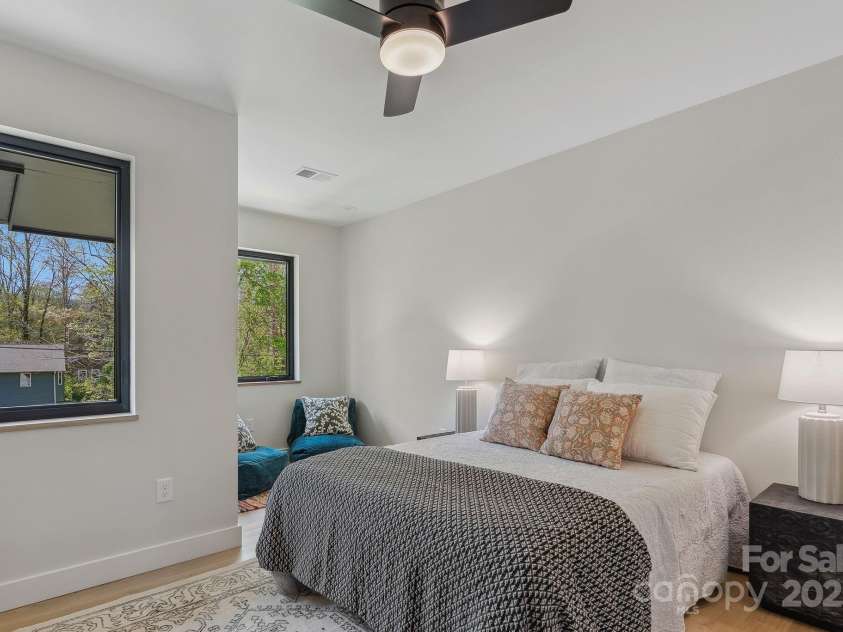 512 Tenth Street, Black Mountain, NC 28711.  MLS# CAR4247173, YatesRealty ID 10193. Front Bedroom with a Wall of Windows