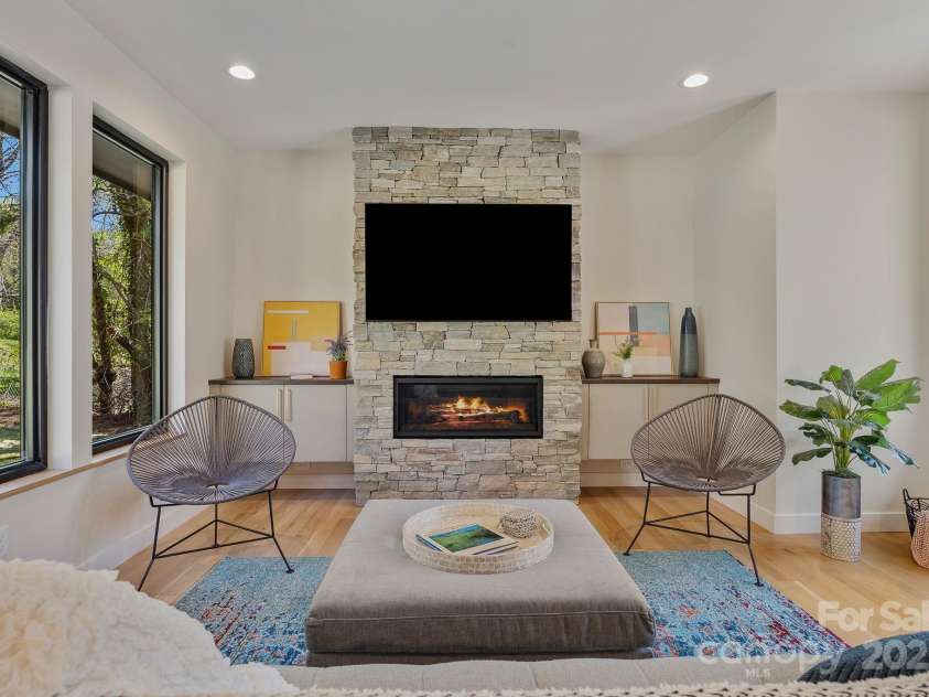 512 Tenth Street, Black Mountain, NC 28711.  MLS# CAR4247173, YatesRealty ID 10193. Stacked Stone Fireplace with Custom Built-ins
